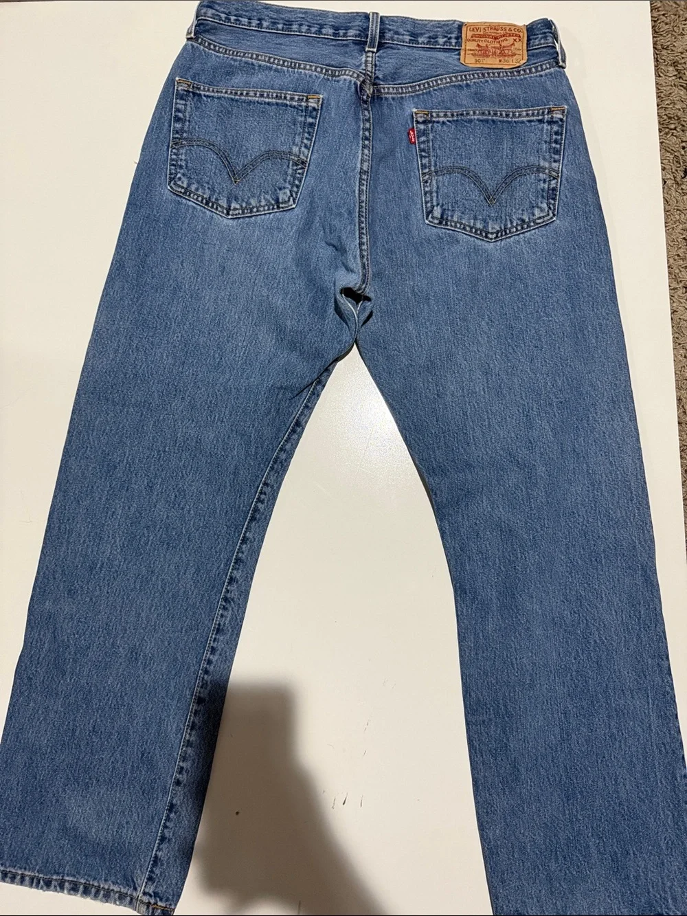 Levi's light blue denim jeans with tan leather patch